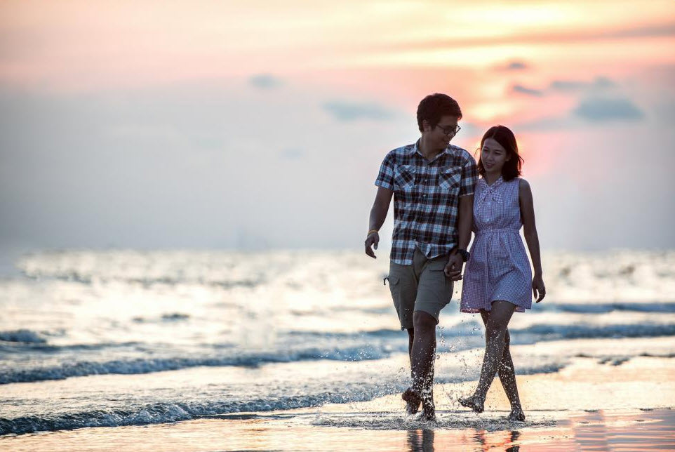 carefree couple on beach